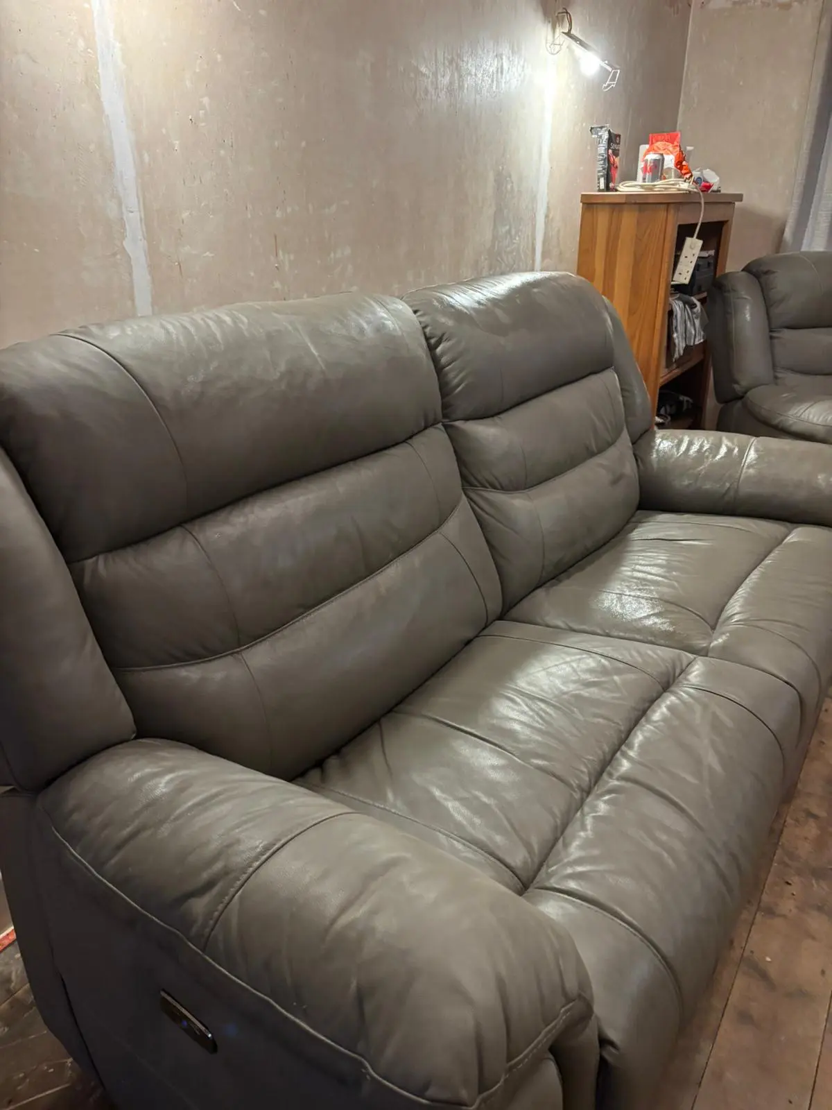 Grey leather sofa and armchair