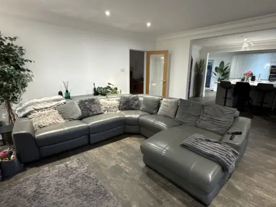 Grey leather corner sofa.