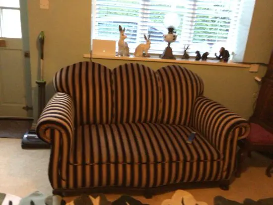 Black and gold art deco sofa