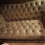 Grey velour Chesterfield 2/3 seater sofa and puffa