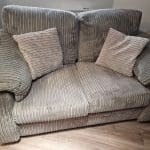 Grey 2 Seater Sofa with 2 pillows and Unused Fabric Care Kit