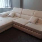 White leather corner sofa bed