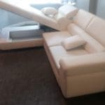 White leather corner sofa bed