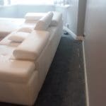 White leather corner sofa bed