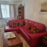 Red leather sofa and chair
