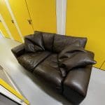 Two brown leather sofas