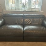 2 grey leather recliner sofas