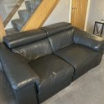 2 grey leather recliner sofas