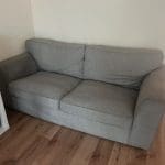 Grey 2 seater sofa can fit 3