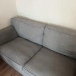 Grey 2 seater sofa can fit 3