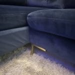Blue velvet chaise corner sofa with ottoman