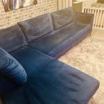 Blue velvet chaise corner sofa with ottoman