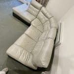 L shaped grey & dark brown leather sofa