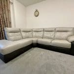 L shaped grey & dark brown leather sofa