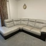 L shaped grey & dark brown leather sofa