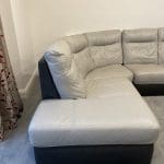 L shaped grey & dark brown leather sofa