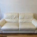 Two cream leather sofas.