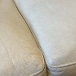 Two cream leather sofas.