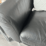 2 black leather sofas with silver feet from DFS
