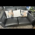 2 black leather sofas with silver feet from DFS
