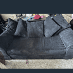 Black plush sofas