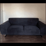DFS black hardy 2 seater sofa and footstool