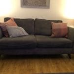 Lovely very clean 2 setter grey sofa with 2 pink/plum cushions