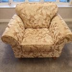 Gold and beige floral armchair