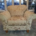 Gold and beige floral armchair