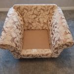 Gold and beige floral armchair