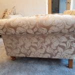 Gold and beige floral armchair