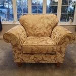Gold and beige floral armchair
