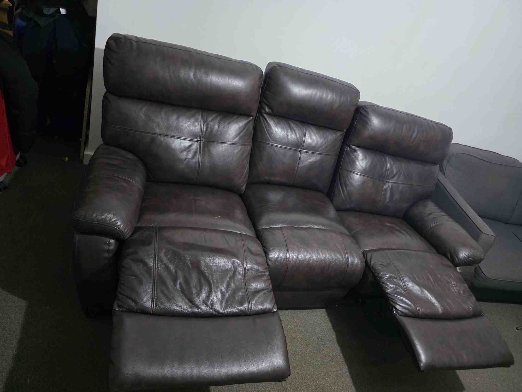 Dark brown 3 seater sofa with 2 seat having manual recliner.
