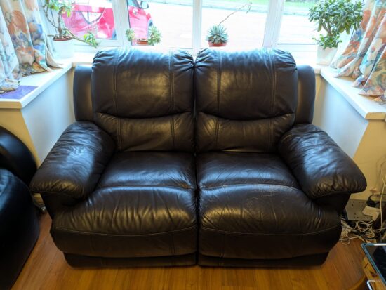 DFS Comfortable 2 Seater Recliner Sofa with Cushioned Arms