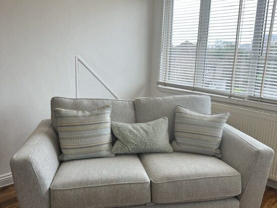 DFS Modern 2-Seater Sofa with Striped Cushions – Perfect for Small Spaces